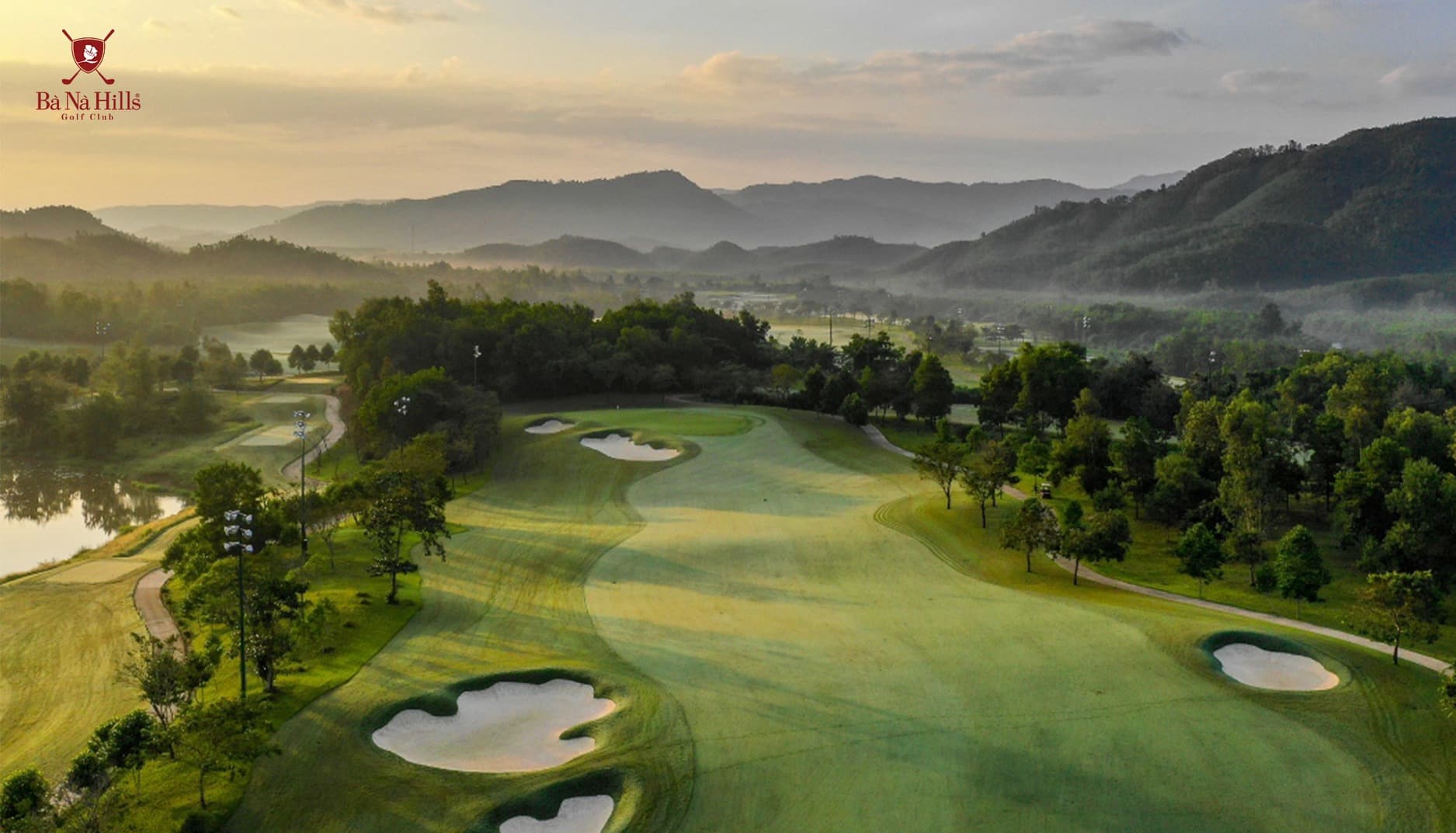 Players walking a scenic championship course at sunset